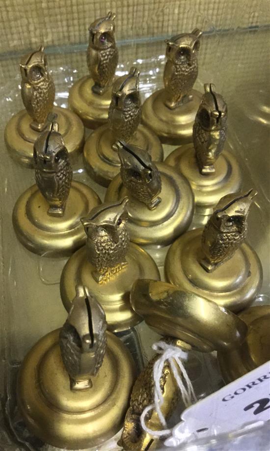 A set of twelve brass owl menu holders, 1.5in.